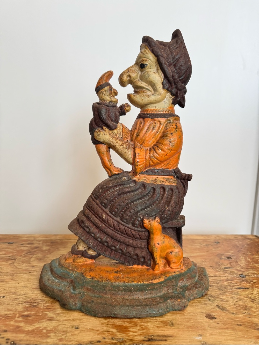 Antique Creepy Cast iron doorstop of Judy from 'Punch and Judy'